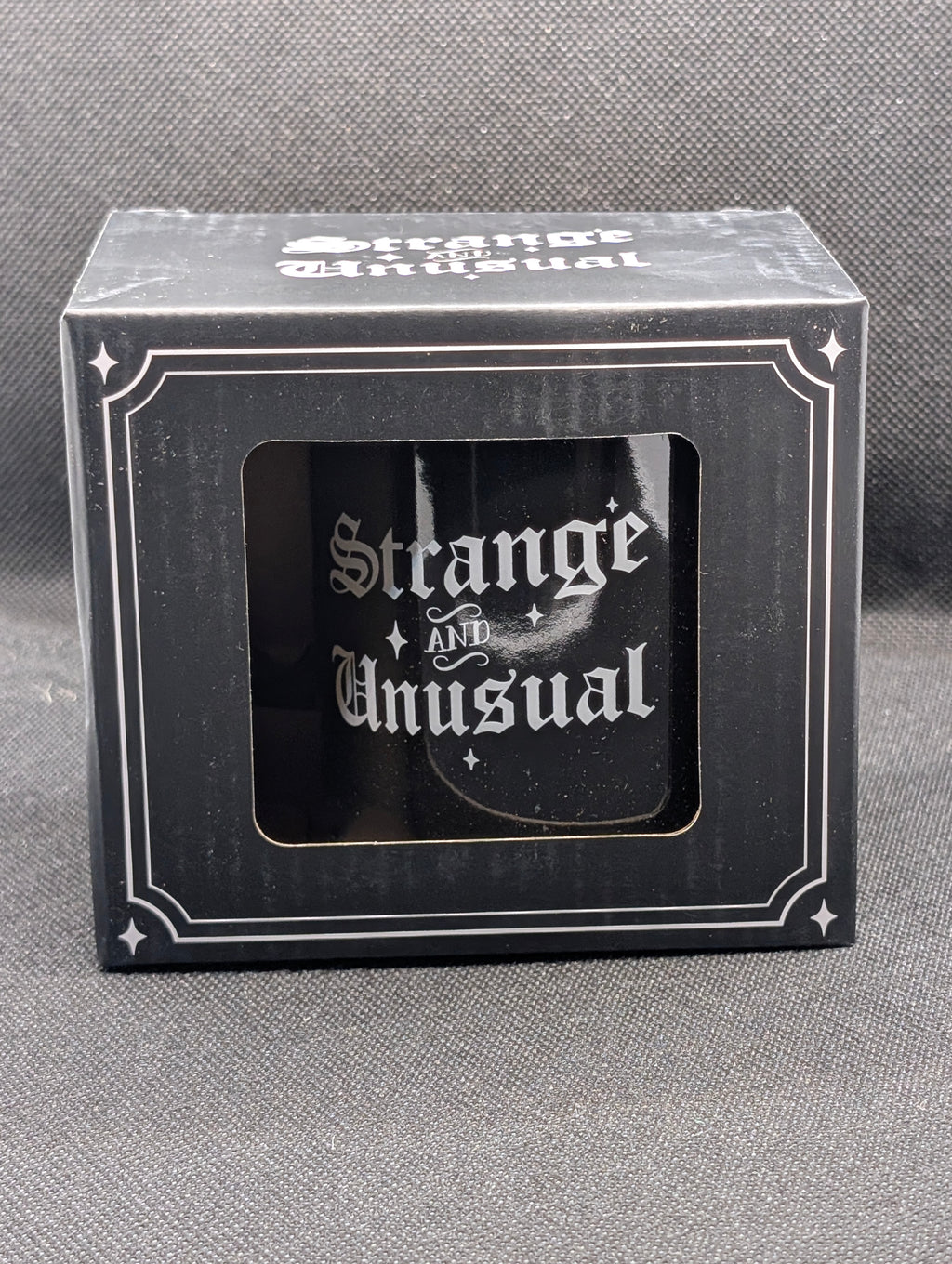 Strange and Unusual mug
