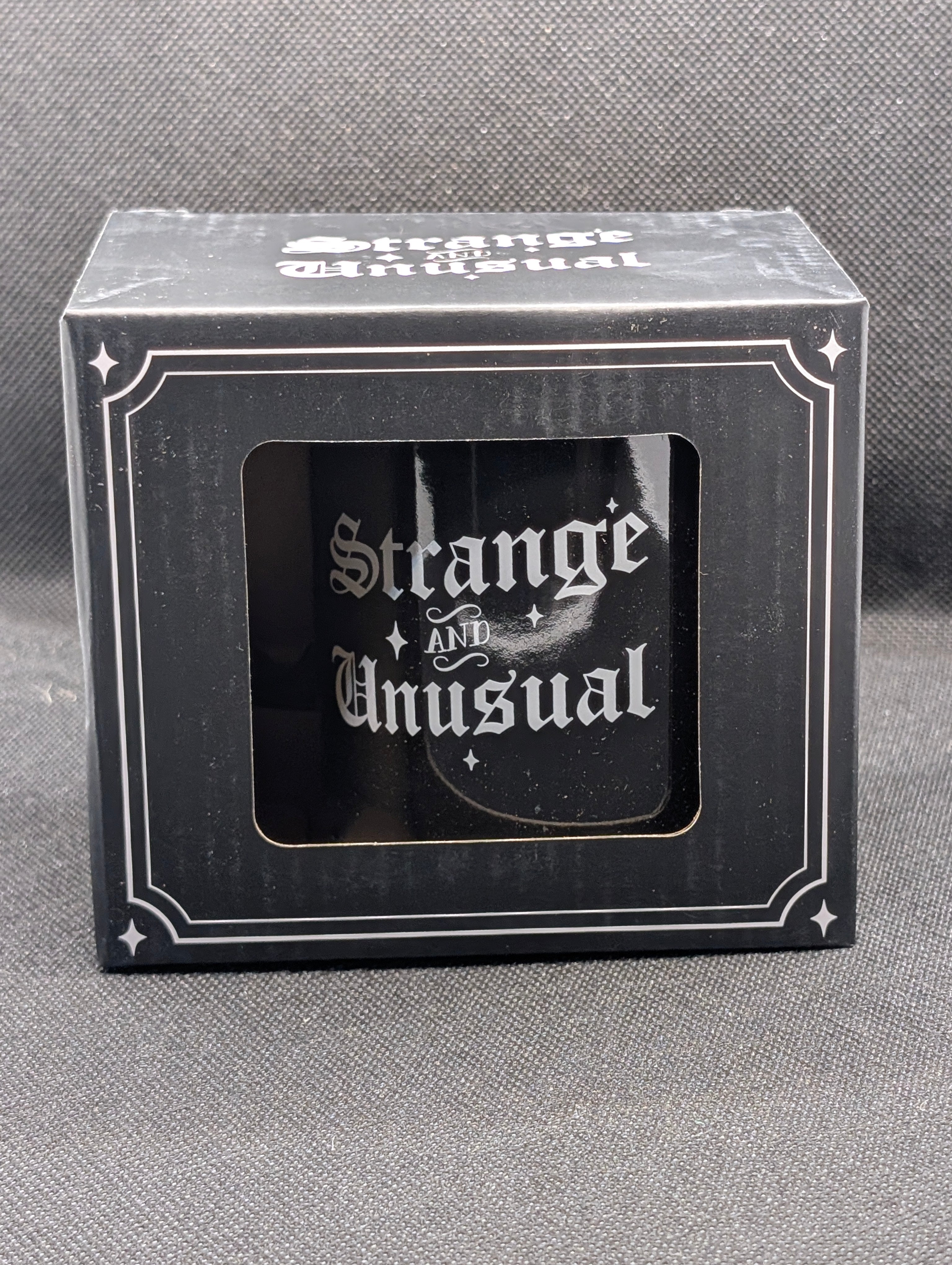 Strange and Unusual mug