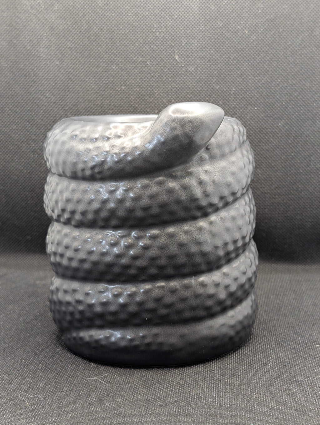 Serpentine wax/oil burner